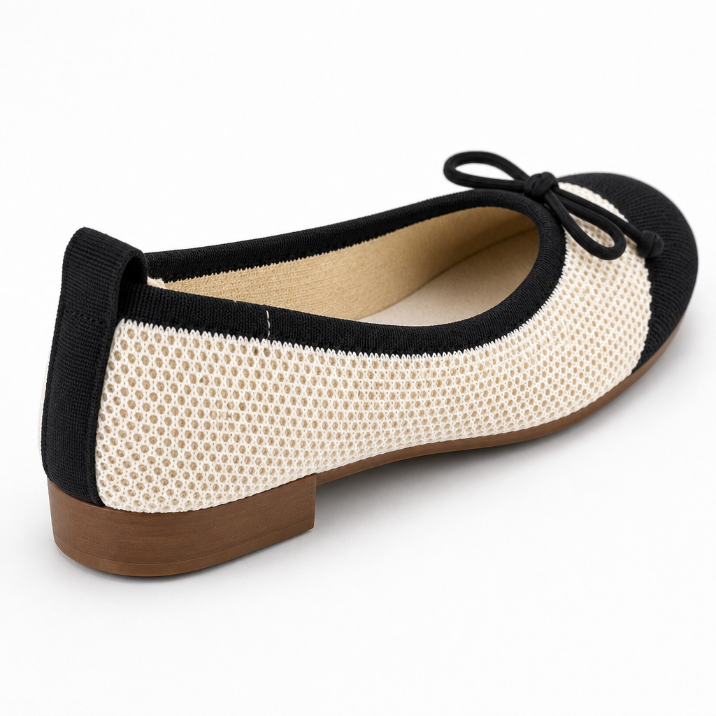 Rear and side angle of the beige black flat shoe