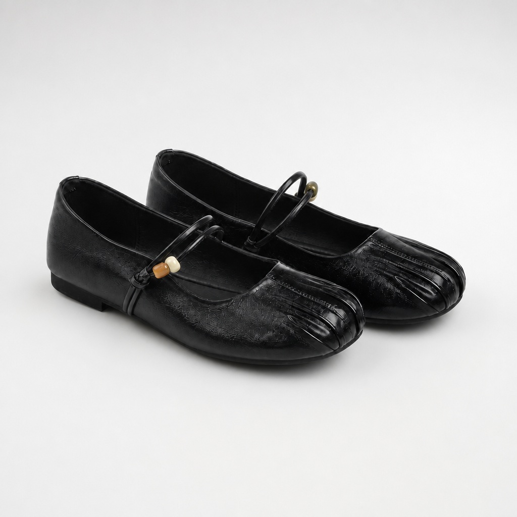Black casual flats on a light background