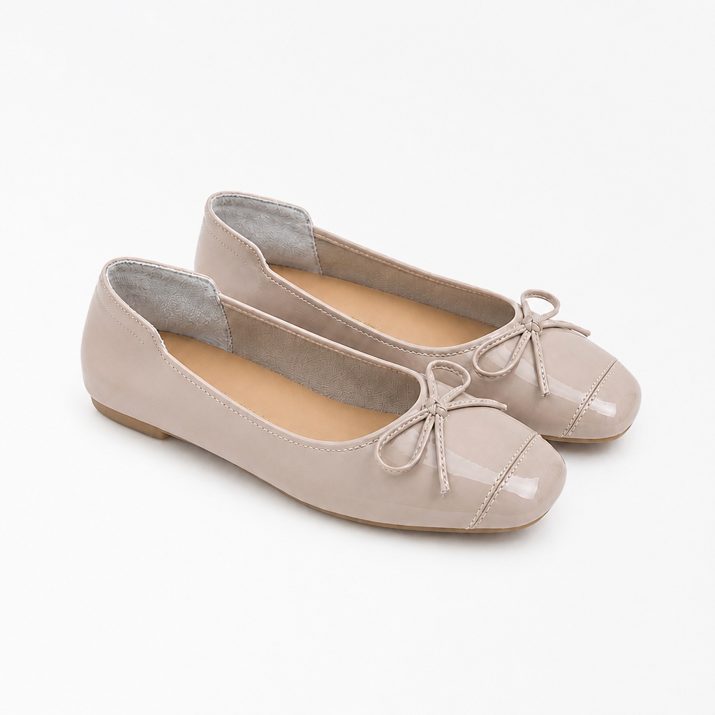 Nude round toe flats on a clean white background