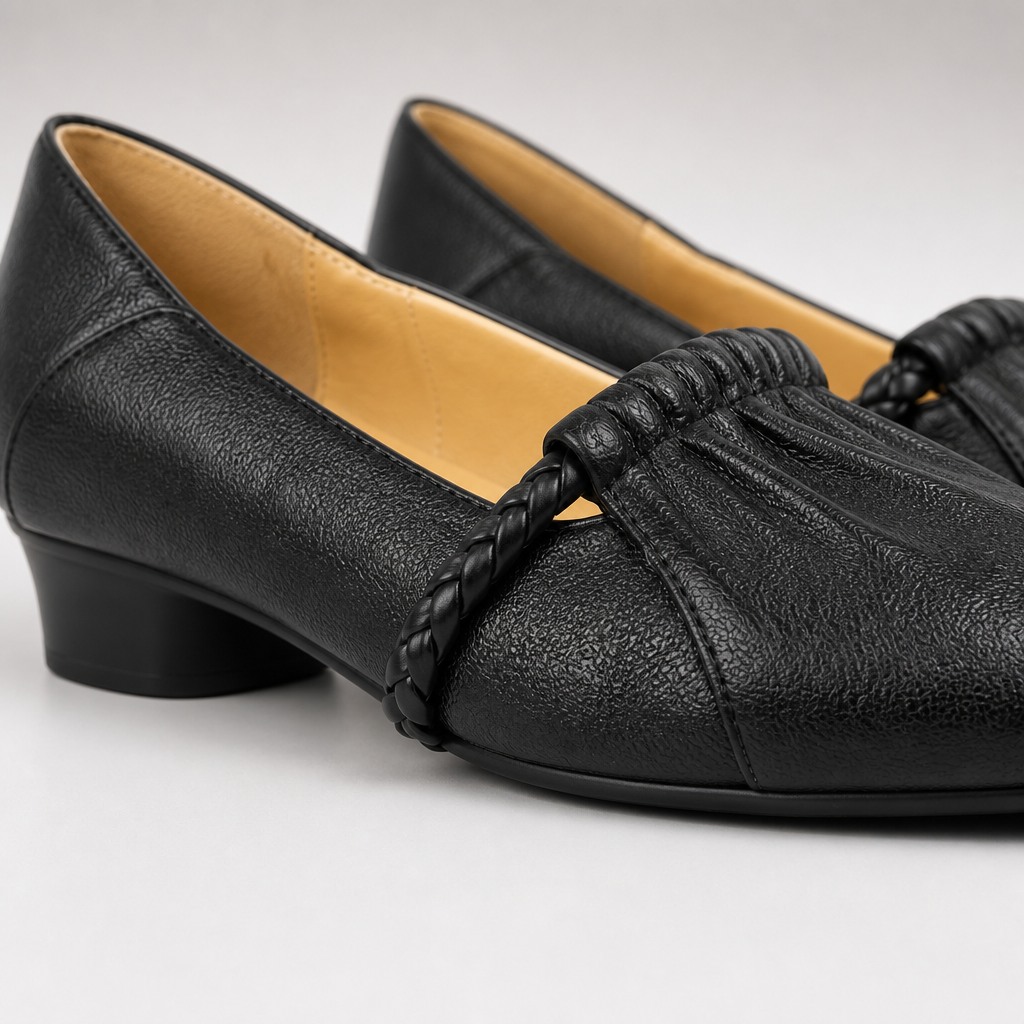 Close-up of black loafer leather texture, lining and heel