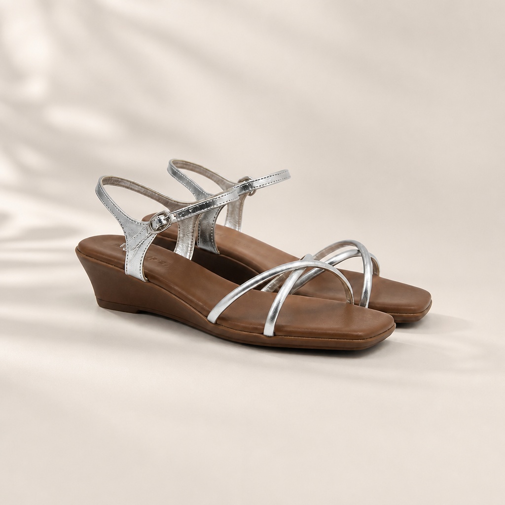 Clear product view of silver square toe wedge sandals