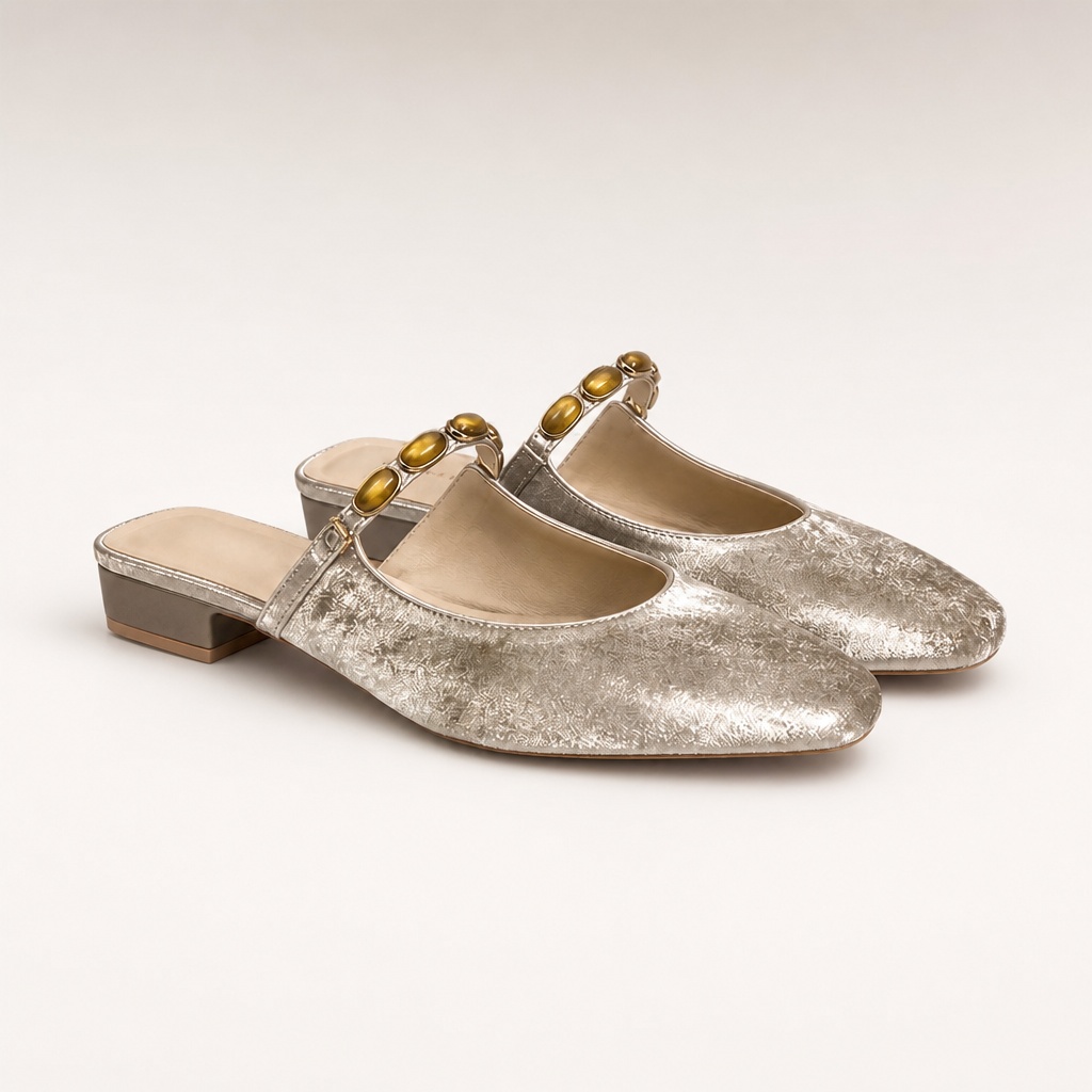 Champagne chunky heel shoes on a plain background