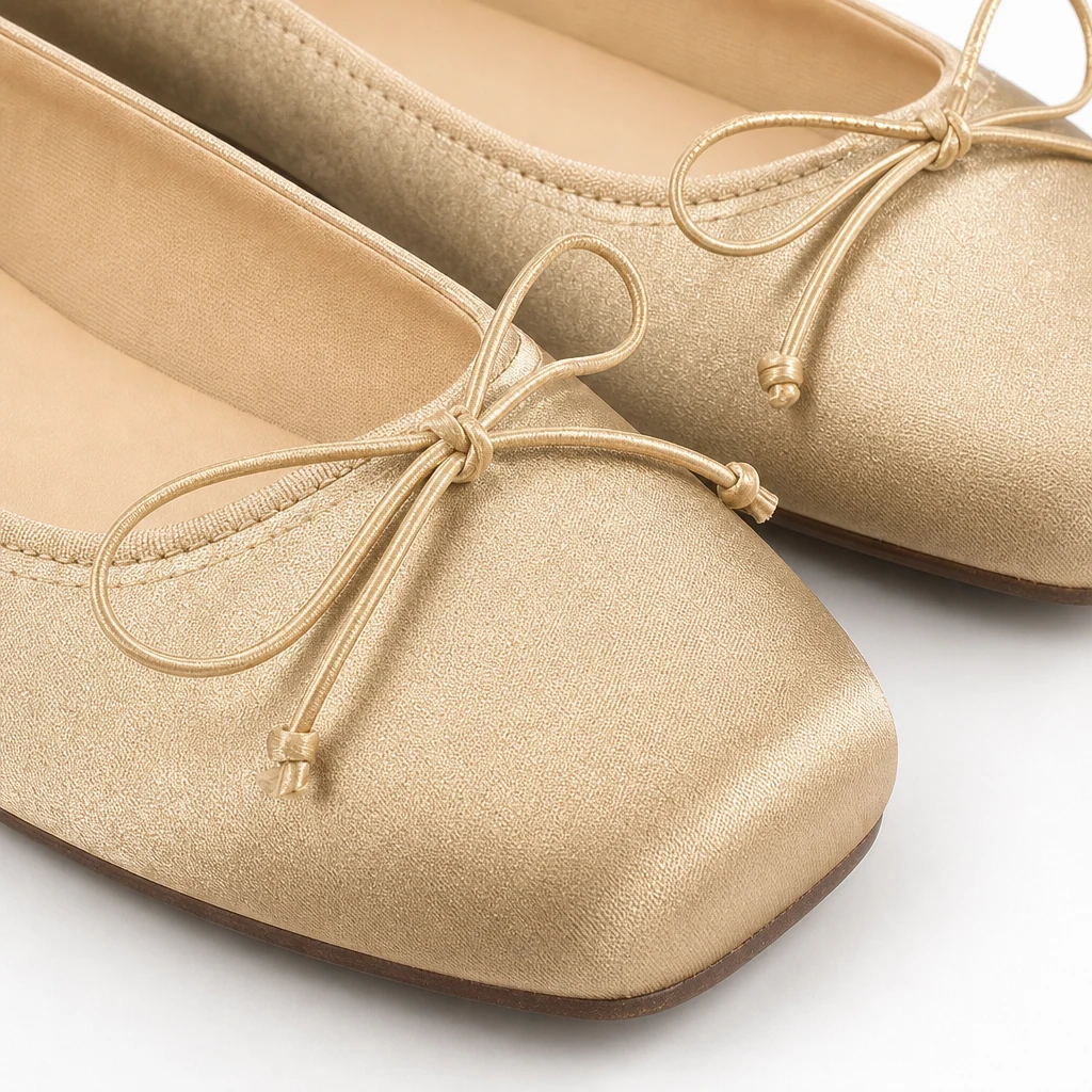 Close-up of bow, toe shape, and material finish on the square toe flats
