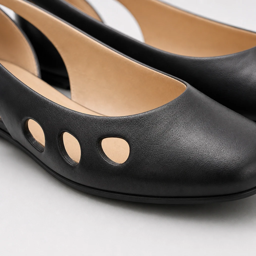 Close-up detail of the black vintage Mary Jane shoe material and construction