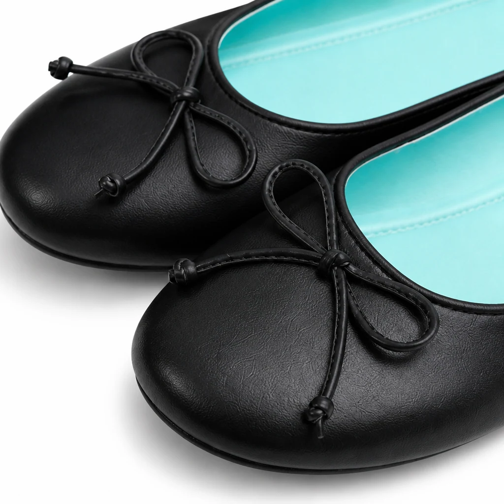 Close-up of the bow detail and material texture on the casual flats